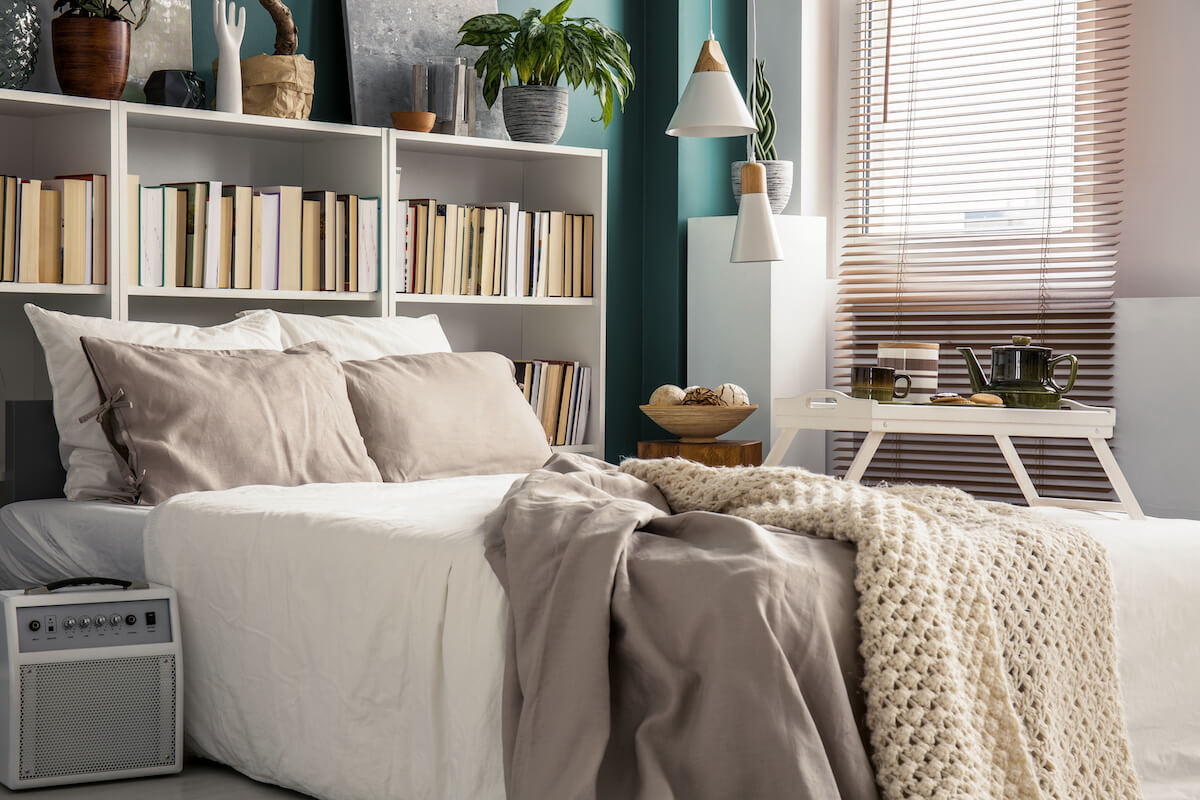 Bed with a bookshelf as a headboard