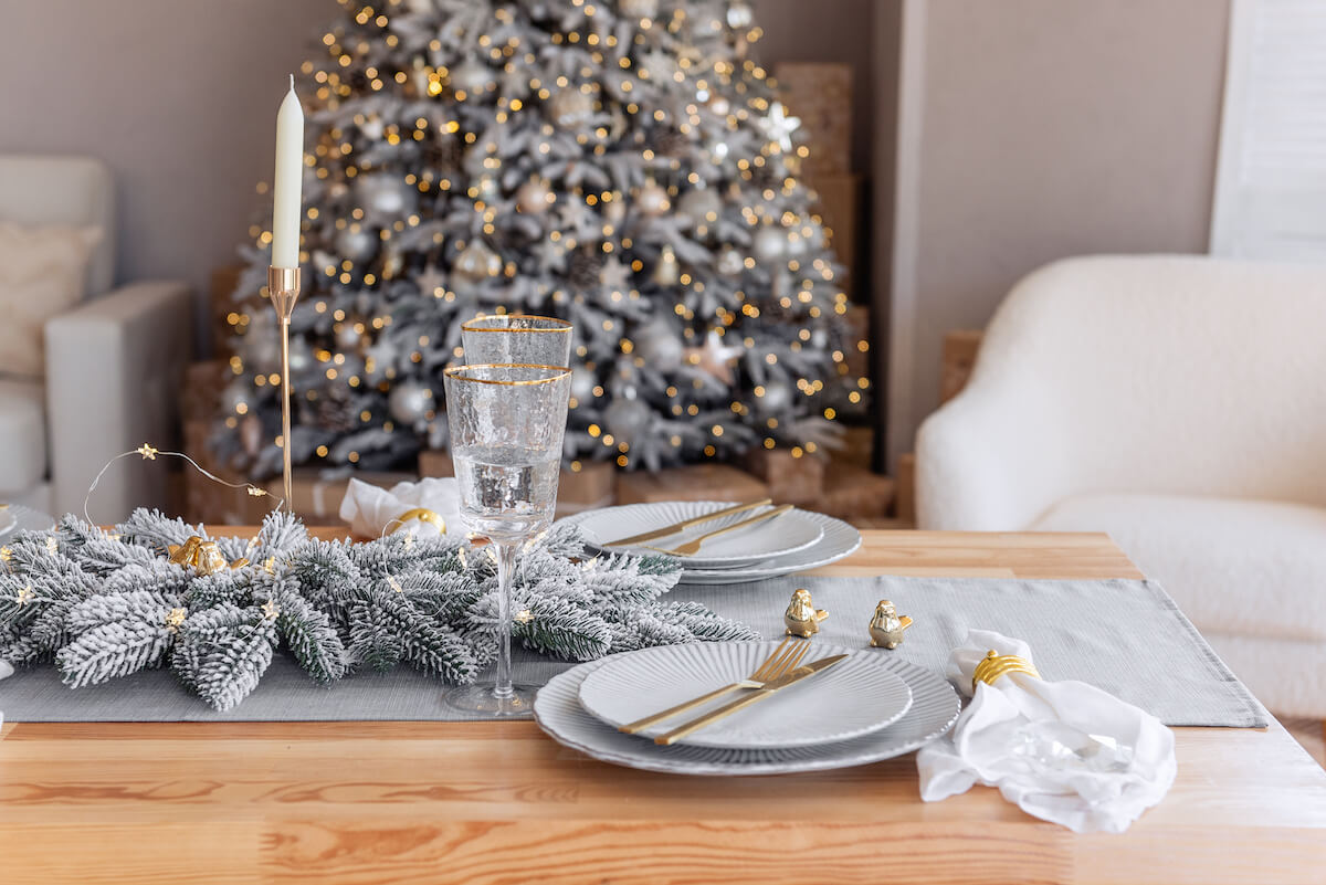 Gold and white Christmas-themed table setting