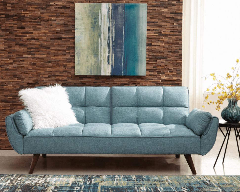 minimalist furniture: blue couch with a white pillow