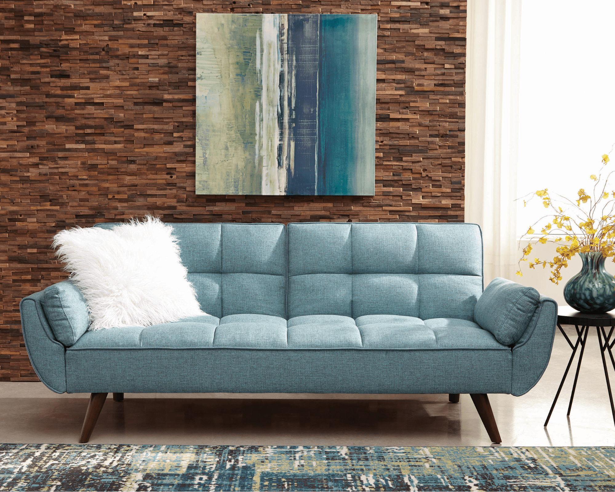 Caufield biscuit-tufted sofa bed turquoise blue