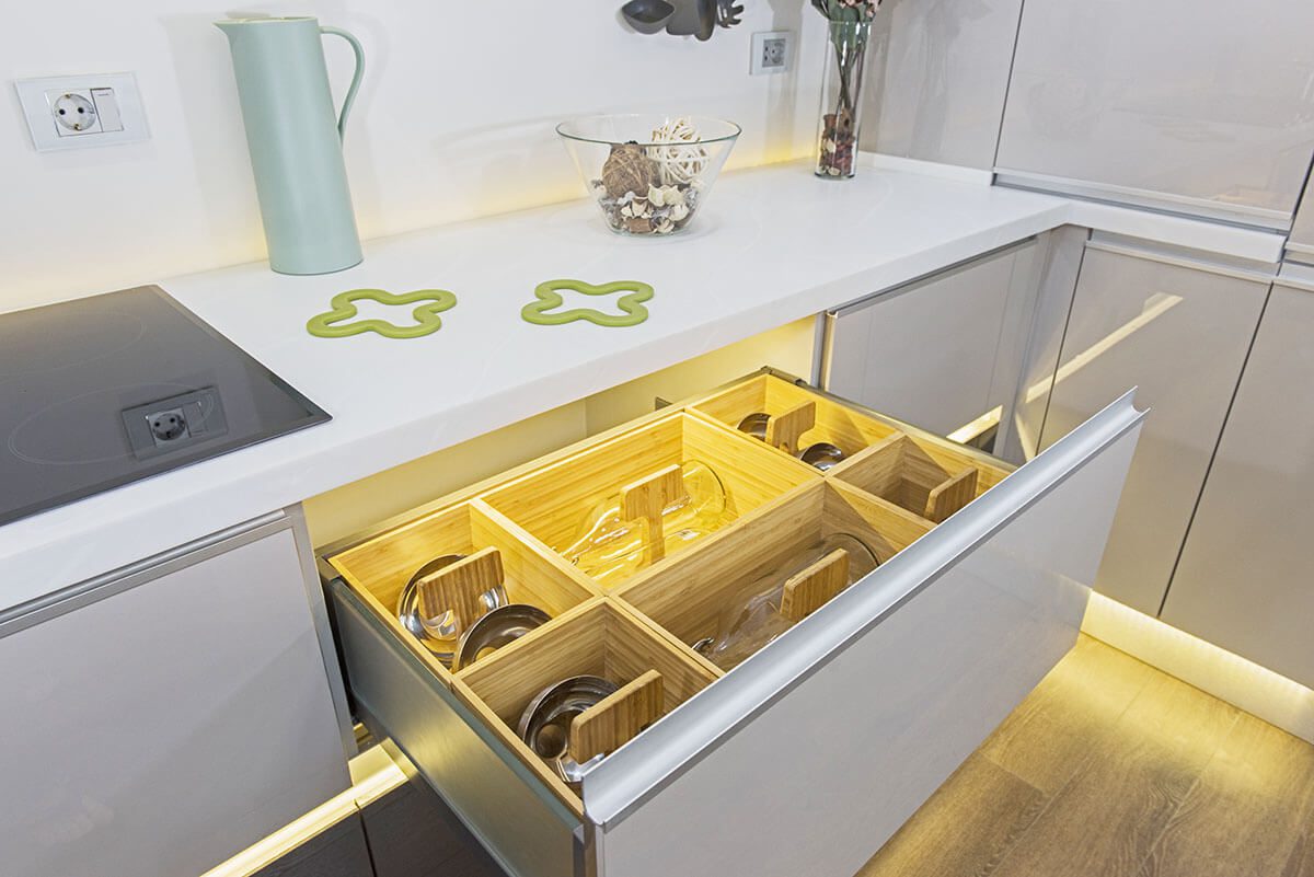 home organization: Kitchen countertop drawer with a wooden divider