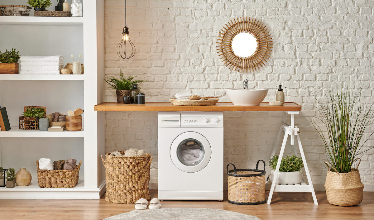 Laundry room with a wooden table and a shelf