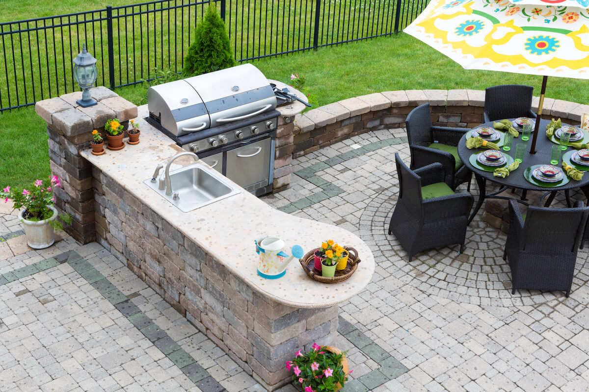 Outdoor kitchen and dining area at a patio