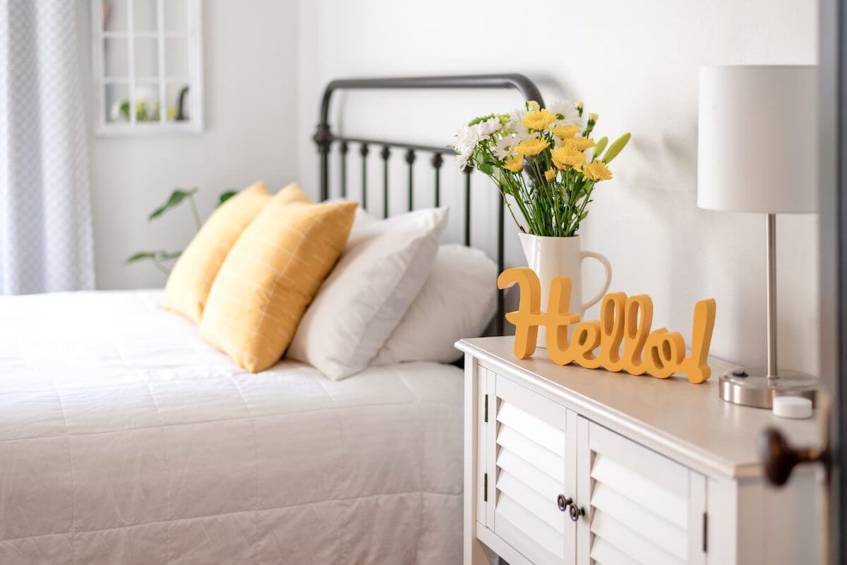 Modern farmhouse bedroom with orange accents