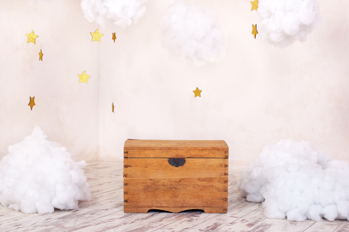 Wooden chest surrounded by cloud-shaped cotton